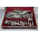 A vintage wooden canteen containing a quantity of assorted silver plated and other cutlery
