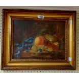 L.A. Cross: a gilt framed oil on canvas board still life with fruit - details verso being a copy