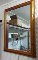 A modern pine framed bevelled oblong wall mirror - 61cm X 84cm