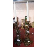 A pair of bronze Rococo style figural candlesticks - sold with battery operated candle