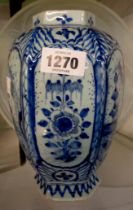 An antique Dutch Delft jar of hexagonal form with hand painted panels (no lid)