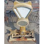 A set of antique shop scales with mirror top and gilt painted finish