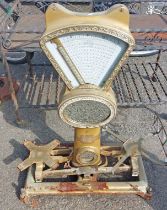 A set of antique shop scales with mirror top and gilt painted finish