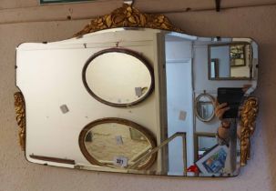 A vintage Mirorbelle Products frameless wall mirror with bevelled plate and applied gilt floral