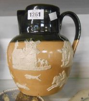 A large Doulton Lambeth harvest ware jug with applied sprigging and green glaze finish