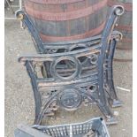 A pair of black painted cast iron bench ends by Streetmaster - dated 2003