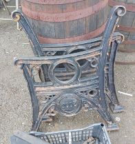 A pair of black painted cast iron bench ends by Streetmaster - dated 2003