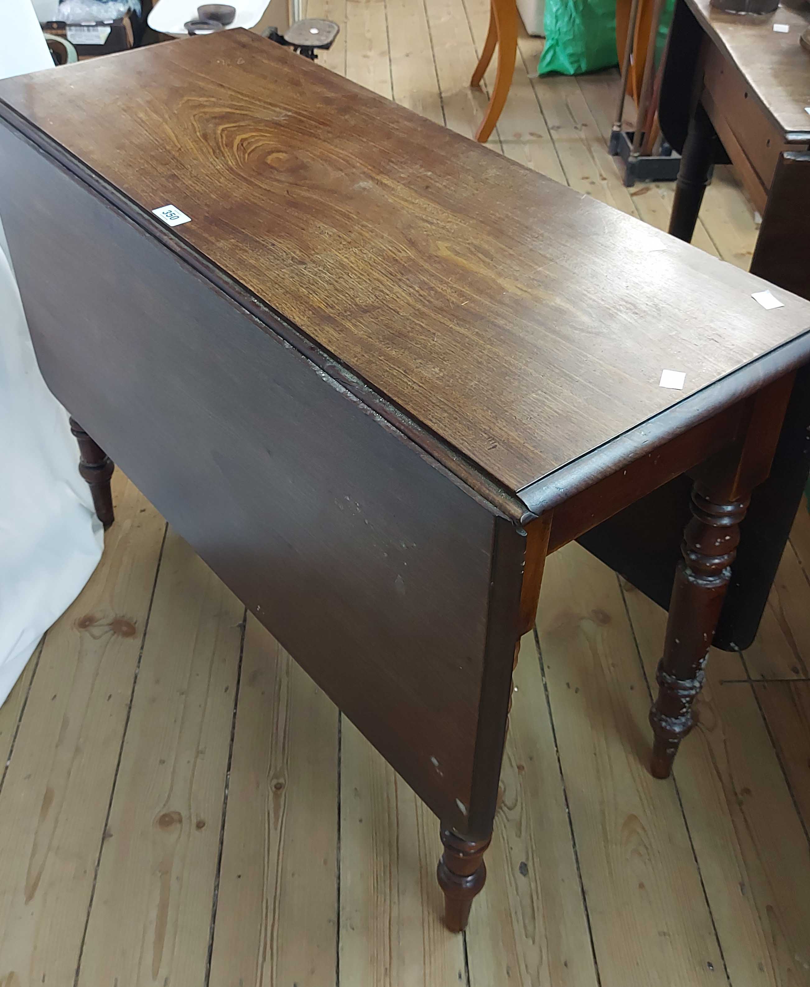 A 96cm mahogany drop-leaf dining table, set on turned legs