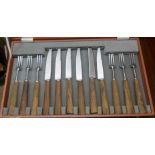 A canteen containing Mills Moore steel steak knives and forks with wooden handles