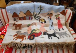 A Botswanan united design hand woven wall hanging rug depicting a typical village view