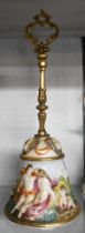 A vintage Napals Capodimonte table bell with typical molded decoration and a gilt metal handle