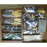 A box containing a quantity of assorted silver plated cutlery and other items