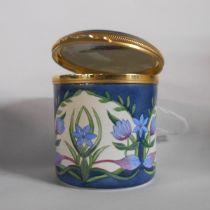 A Moorcroft enamel lift-top trinket box with printed marks to base and dated 2001 - sold with