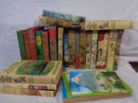 A crate containing a quantity of vintage Enid Blyton titles and other books - various editions
