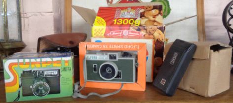 A box containing four vintage cameras including Ilford Sprite 35, a cased Kodak 'Brownie' 127, etc.