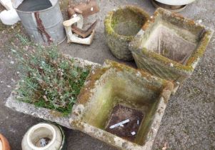 A pair of small concrete square planters with tapered sides and moulded hedgehog decoration - sold