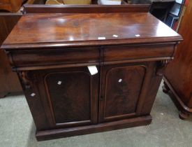 A 98cm Victorian mahogany chiffonier with two blind frieze drawers and double cupboard under, set on