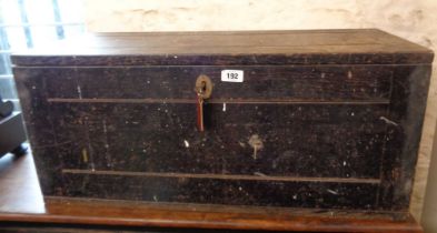 An old black painted wood lift-top toolbox with iron drop handles - sold with a woodgrain effect