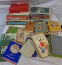 A box containing a selection of old books including 'The World We Live In', 'Dandy the Donkey',