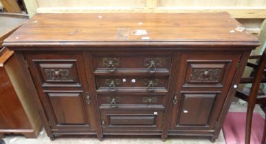 A 1.54m late Victorian walnut sideboard with three central drawers and cupboard flanked by further