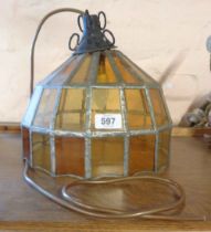 An old hanging lamp with leaded coloured glass shade