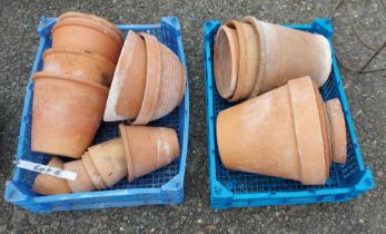 Two crates containing a quantity of assorted terracotta plant pots