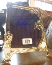 An Art Nouveau style brass easel mirror