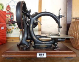 A vintage hand operated Wilcox and Gibbs sewing machine