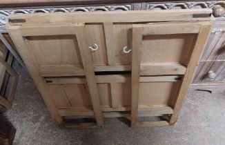 Two similar modern mixed wood folding bookcases, one with three shelves, the other two