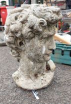 A 40cm high concrete bust depicting the head of Michaelangelo's David