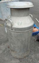 A vintage Ambrosia Ltd. aluminium milk churn with lid