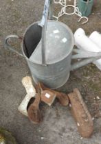 A galvanised watering can - sold with an old flat iron and two shoe lasts