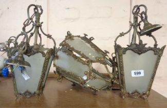 An old cast brass hanging ceiling lamp with frosted glass panels chain and fittings - sold with