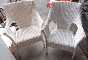 A pair of white painted wicker conservatory chairs