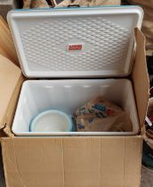 A boxed Coleman cool box containing two ceramic chamber pots