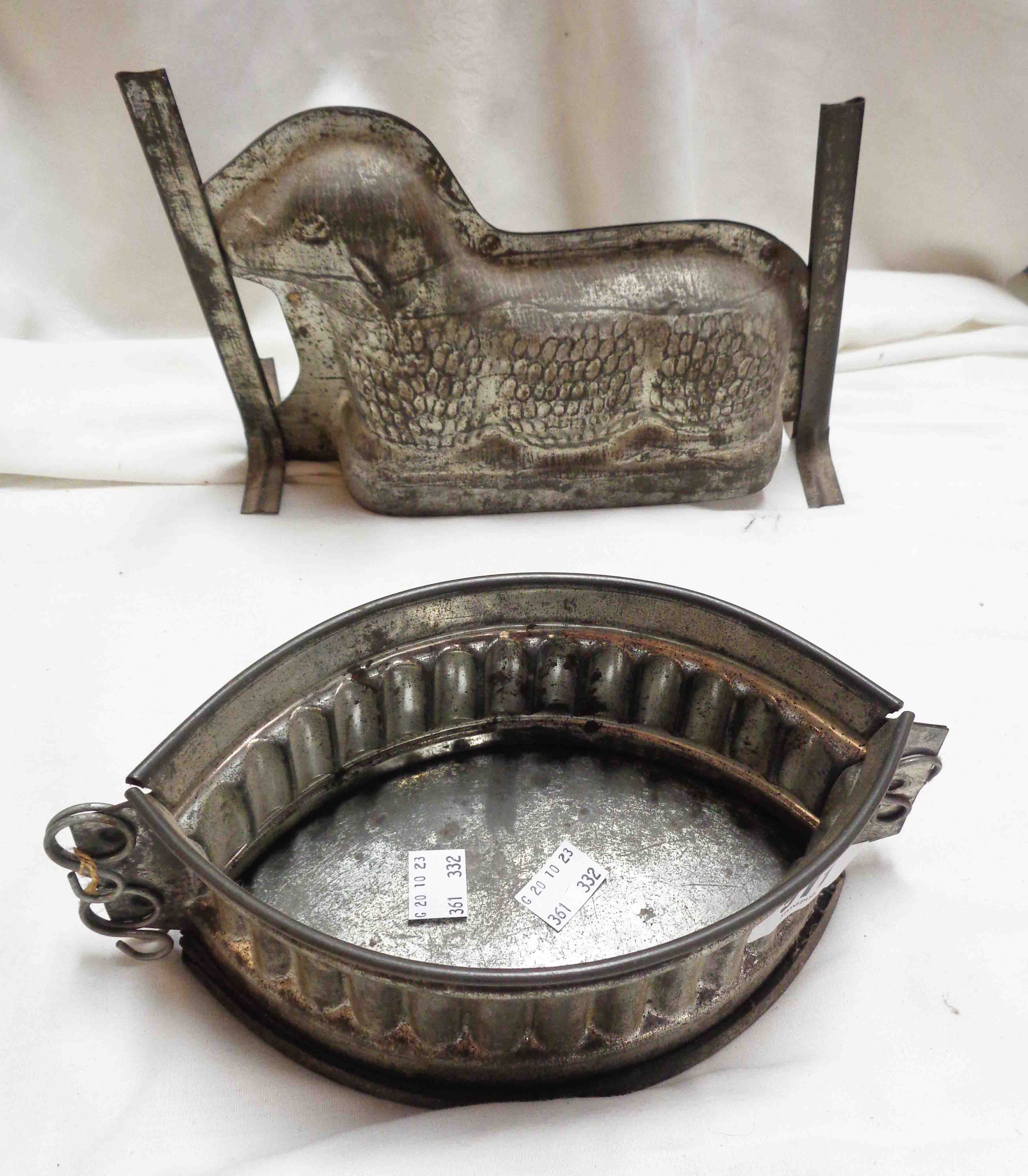 Two vintage pressed tin jelly moulds