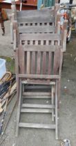 A set of four wooden folding garden elbow chairs