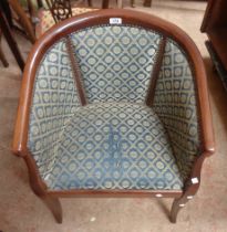 A modern stained wood show frame tub chair with blue tapestry upholstery