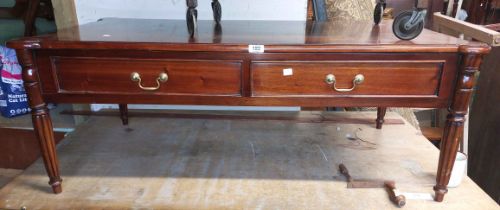 A 1.23m reproduction mahogany coffee table with opposing double frieze drawers, set on reeded legs