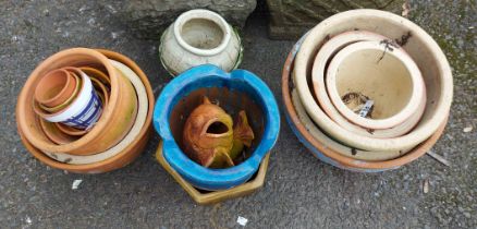 A selection of assorted garden plant pots of various size and form