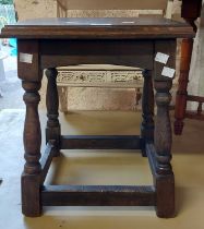 A reproduction stained oak joint stool style tea table, set on turned supports