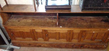 A 2.43m antique stained pine shop counter from Mountfords Ironmongers, Bovey Tracey with partitioned