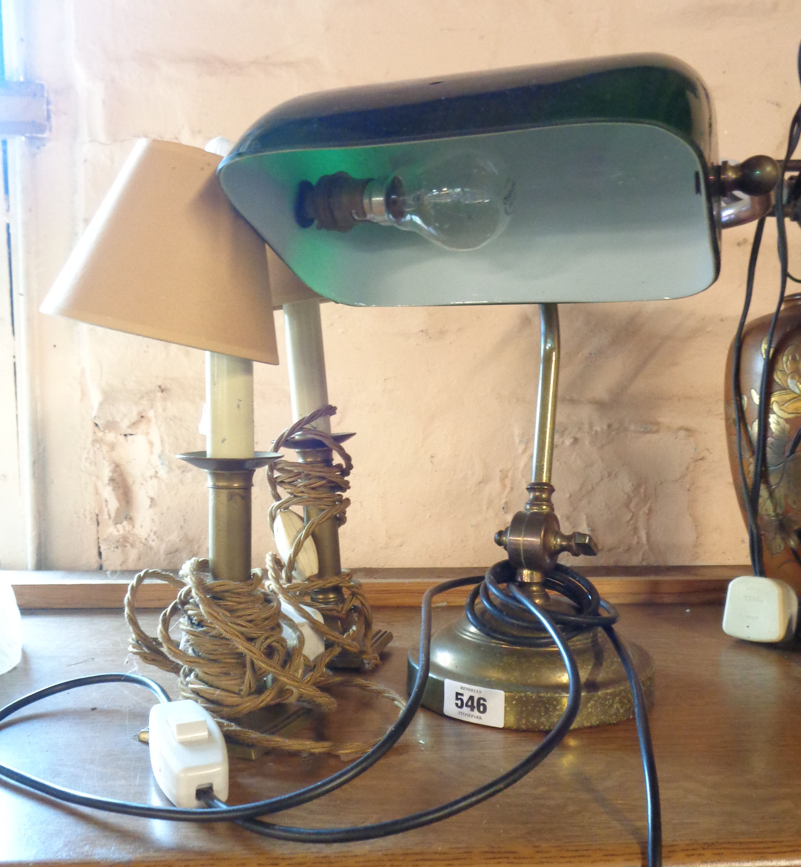 A vintage banker's style desk lamp, with opaque green glass shade and brass body - sold with a