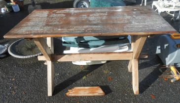 A vintage pine table, set on an X-frame base - one foot broken but included