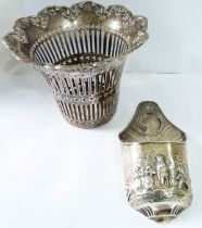 A small Chester silver wall pocket with embossed figural decoration - sold with a silver pierced