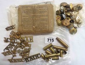 A quantity of assorted military buttons, RASC insignia badges and others, small shell cases and a