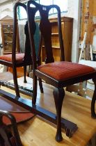 A set of four old mahogany framed Queen Anne's style dining chairs with upholstered drop-in seats,