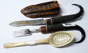 An antique Alpine region travelling cutlery set comprising goat horn handled knife and fork with