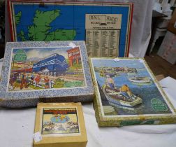 An incomplete Round Britain Rail Race game including metal and plastic train playing pieces,