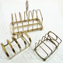 A silver toast rack with loose dividers - sold with two smaller similar - varying designs